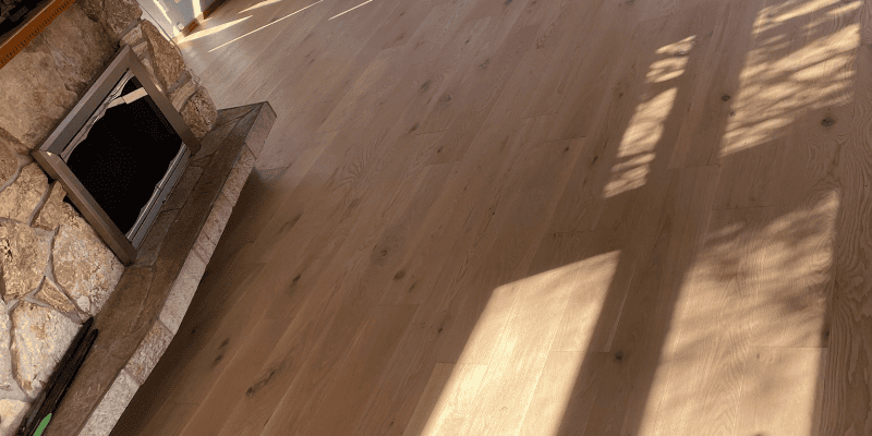 Carpet Replacement 1 Wooden floor with stone fireplace, carpet replacement Redmond, Kirkland, Sammamish, Issaquah, Bellevue