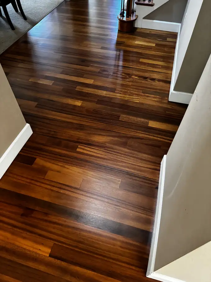 Refinished tatajuba hallway floor leading toward the staircase