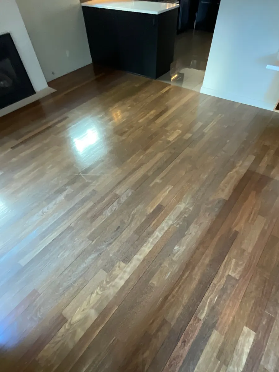 Ipe Floor Refinishing in Capitol Hill, Seattle 3 Worn ipe hardwood floor in a Capitol Hill, Seattle living room before refinishing