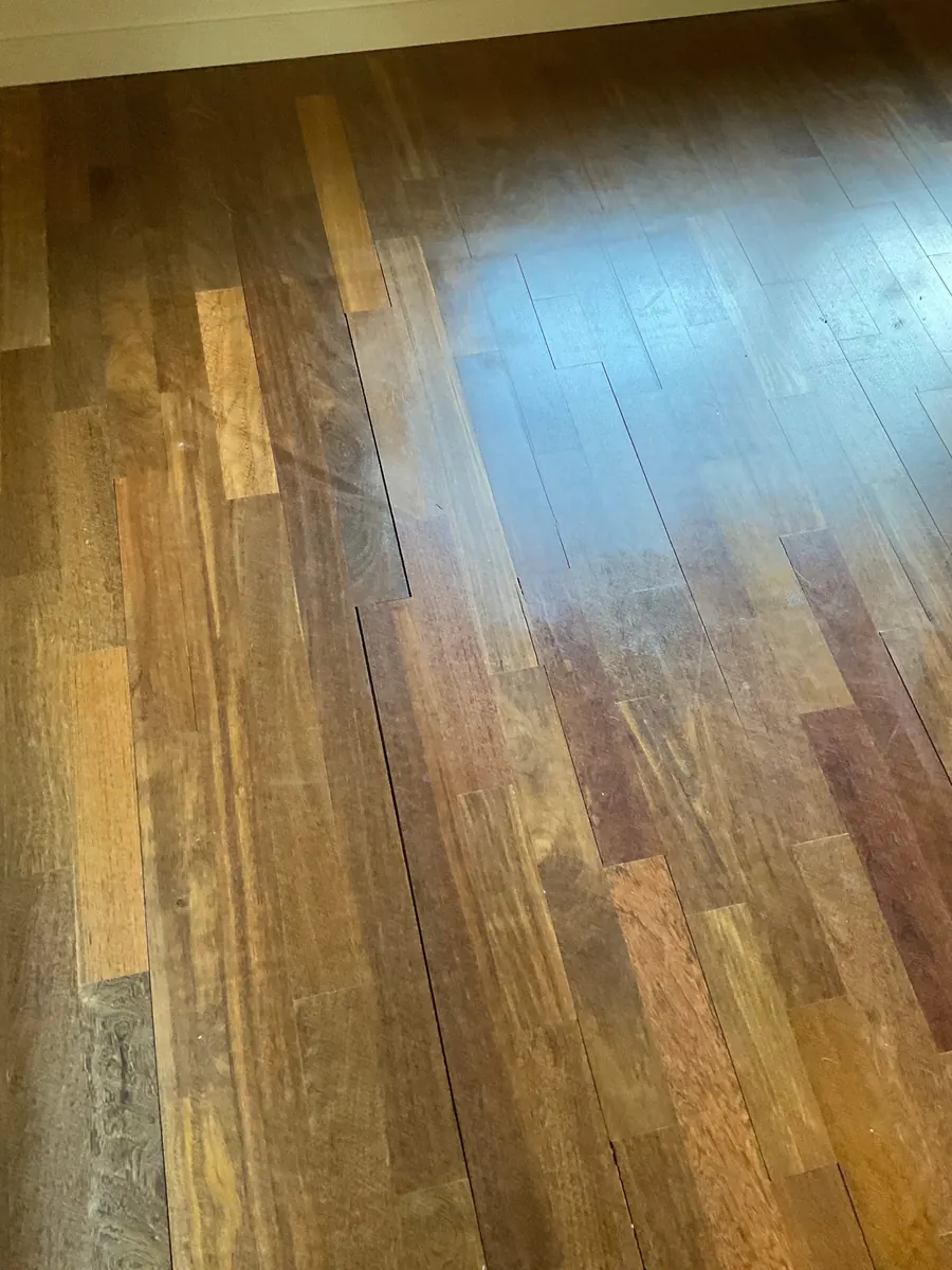 Ipe Floor Refinishing in Capitol Hill, Seattle 4 Close-up of hazy, scratched finish on ipe floorboards before sanding